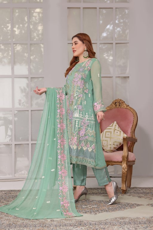 Cool green 3 piece multi colored embroidered suit heavy dupatta.