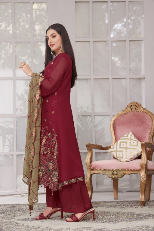 Dull Red embroidered suit with contrast skin jaal dupatta.