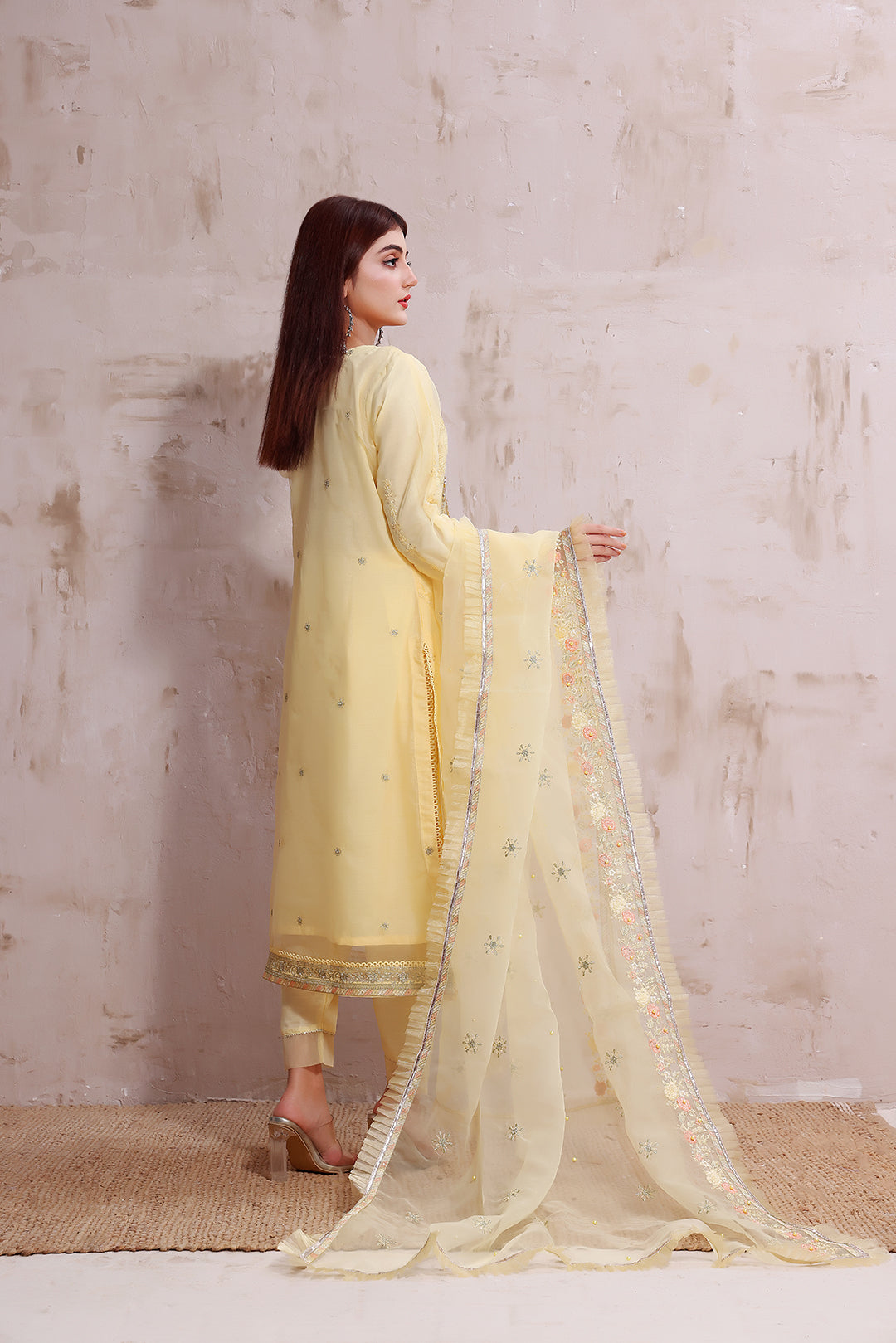 Pale Yellow intricately embroidered ready made organza suit.